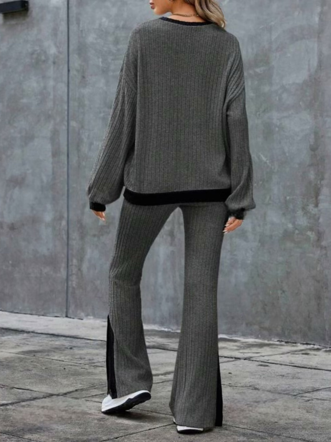 Gray ribbed knit lounge set with slit hem pants and crew neck sweater.