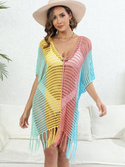Colorblock crochet cover-up with fringe and V-neck in pastel shades of green, yellow, pink, and blue.