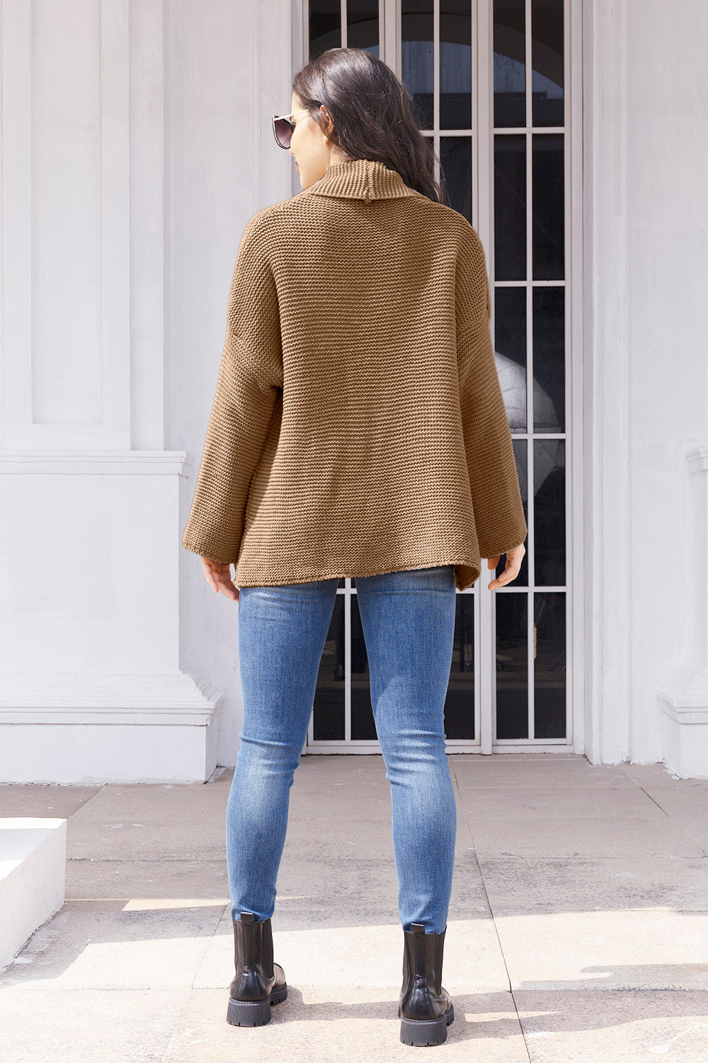 Camel waffle knit cardigan with a shawl collar and relaxed fit.