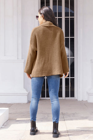Camel waffle knit cardigan with a shawl collar and relaxed fit.