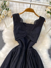 Black eyelet maxi dress with cutout detail, square neckline and ruched bodice.