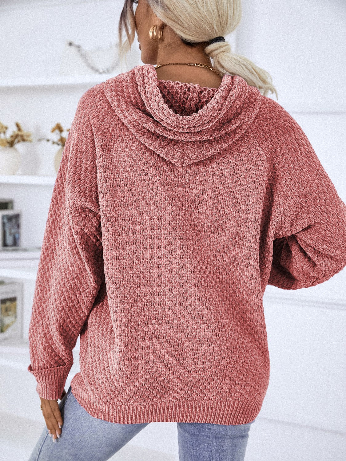Textured knit raglan sleeve hoodie in burnt coral with a cowl neck and relaxed fit.