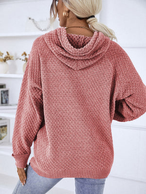 Textured knit raglan sleeve hoodie in burnt coral with a cowl neck and relaxed fit.
