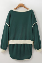 Dark green sweatshirt and skort set with cream contrast trim and neckline