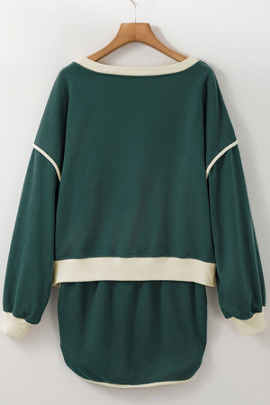 Dark green sweatshirt and skort set with cream contrast trim and neckline