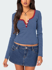 Striped long sleeve henley shirt with contrast collar and buttons in blue.