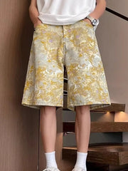 Floral print wide-leg denim shorts in yellow and white, made of 100% cotton.