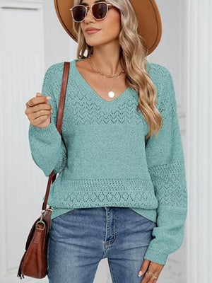 Turquoise diamond eyelet knit v-neck sweater with long sleeves and a relaxed fit.