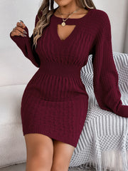 Wine cable knit mini dress with keyhole neckline and long sleeves.
