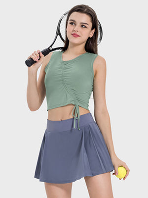 Gum Leaf asymmetric ruched crop tank top with drawstring detail.