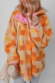 Checkerboard sherpa jacket in tangerine with pink contrast collar and trim.