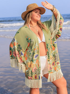Sage floral print kimono cover-up with fringe details and wide sleeves.