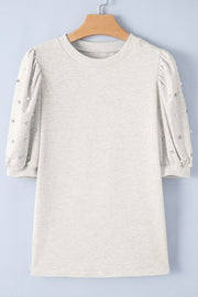 Light gray embellished puff sleeve sweatshirt with pearl and rhinestone details.