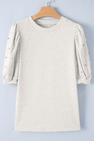 Light gray embellished puff sleeve sweatshirt with pearl and rhinestone details.