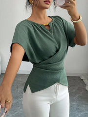 Green short sleeve maternity blouse with beaded keyhole neckline and wrap detail