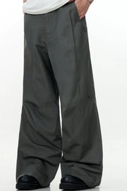 Men's wide leg cargo pants in army green with a relaxed fit and side pockets.