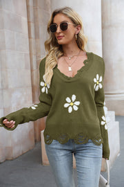 Olive brown acrylic sweater with daisy appliques and distressed edges.