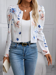White floral puff sleeve cropped zip jacket with round neckline and silver zipper.