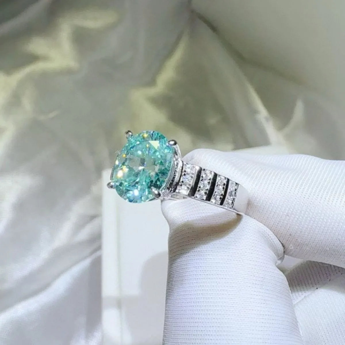 Aquamarine halo oval ring with diamond band.