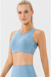 Light blue sports bra with a racerback and seamless design.