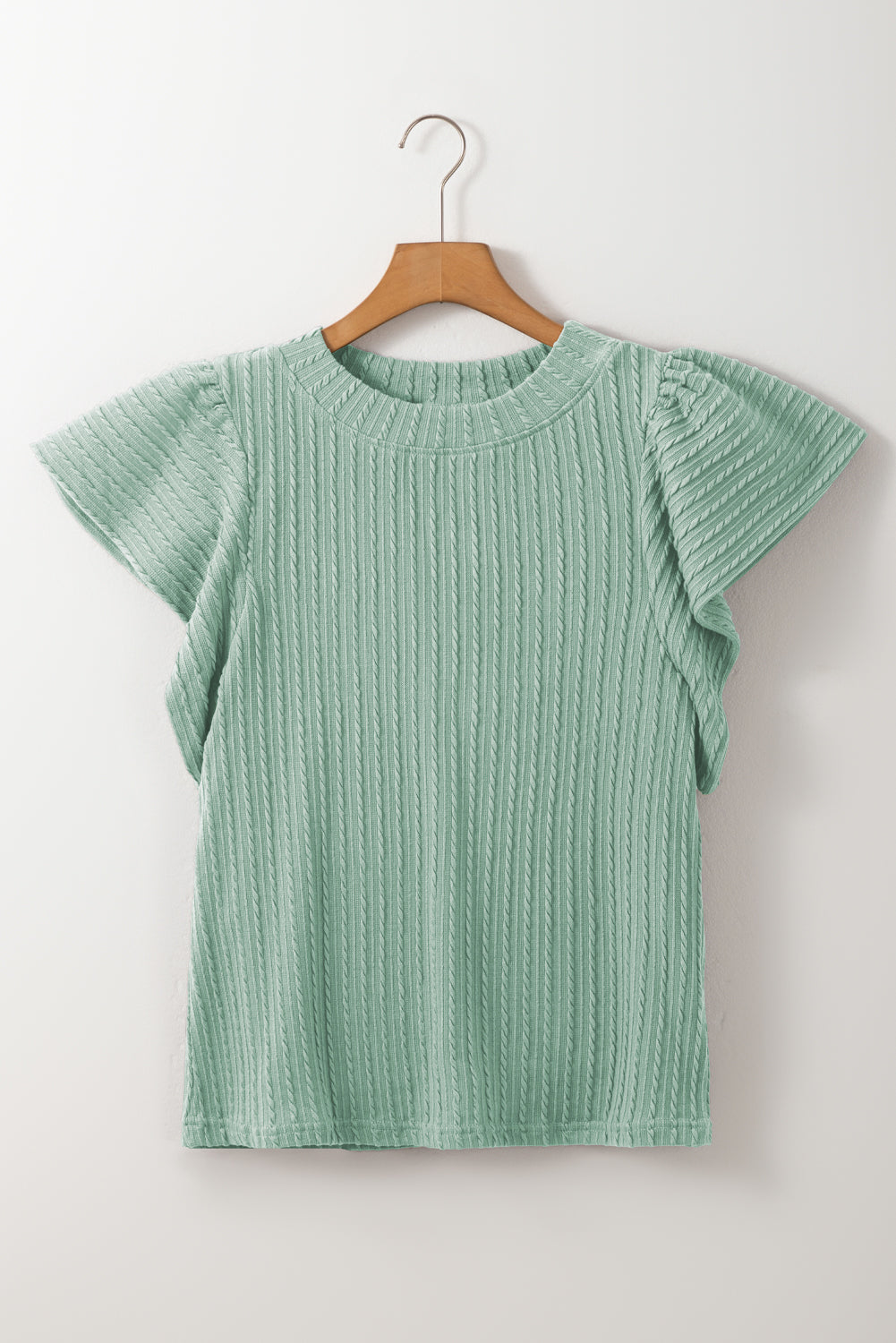 Textured cable knit top in Gum Leaf green with flutter sleeves and a mock neckline.