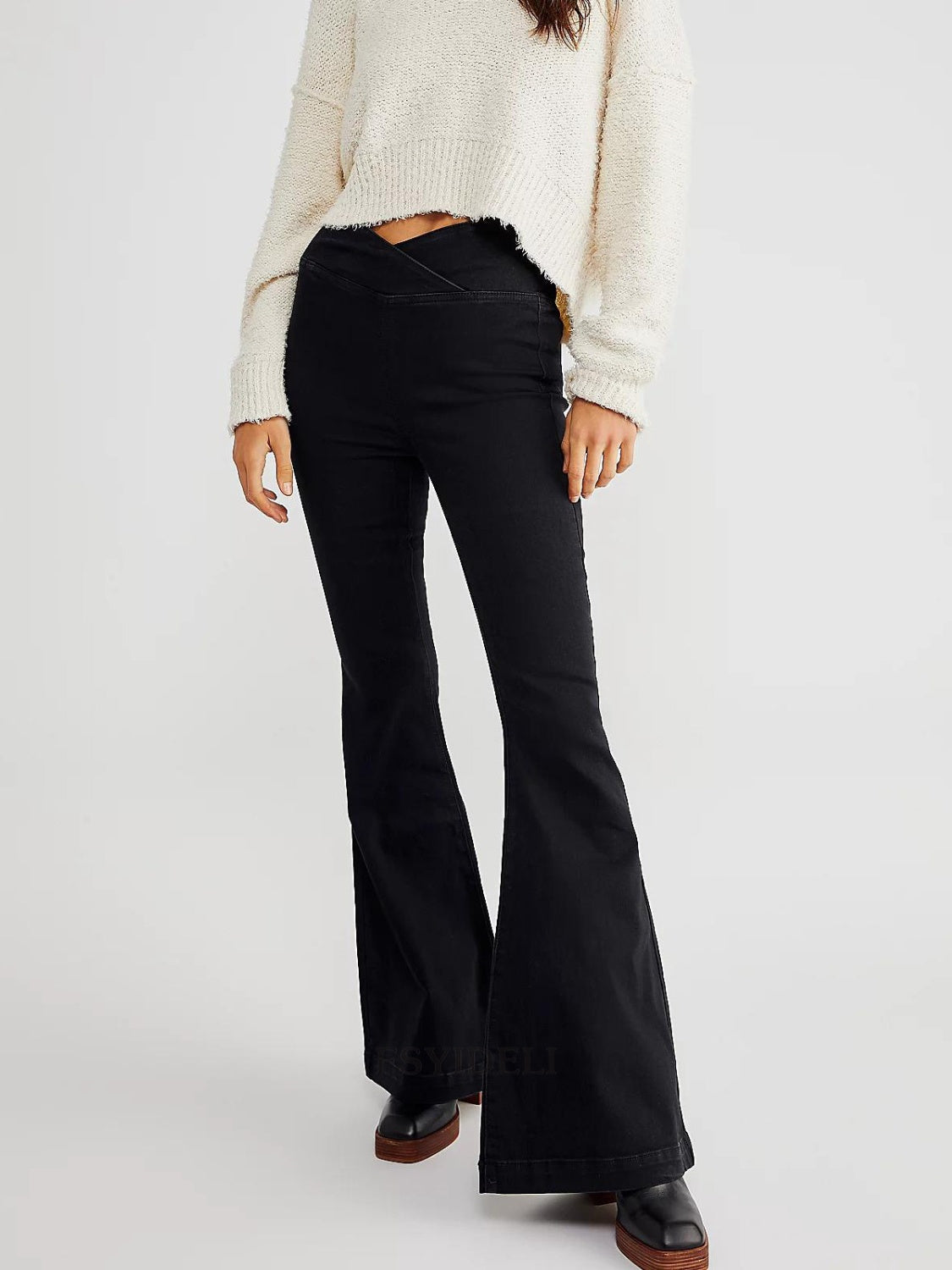 Black flare jeans with a V-shaped waist detail