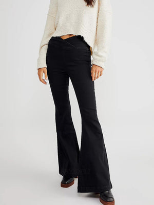 Black flare jeans with a V-shaped waist detail