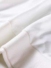 White cotton crew neck sweatshirt with ribbed cuffs and hem detail.