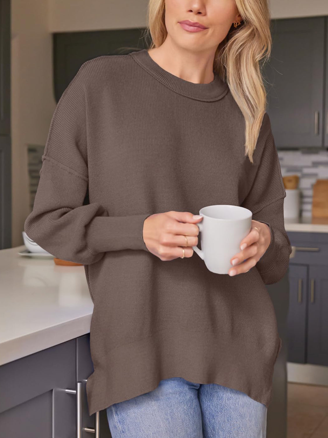 Ribbed-knit relaxed fit sweater in brown with crew neck and long sleeves.