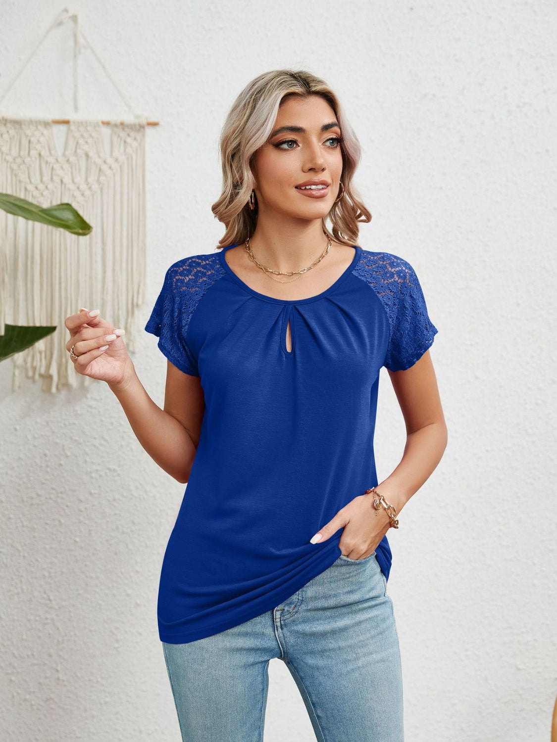 Royal blue polyester blouse with keyhole neckline and lace cap sleeves