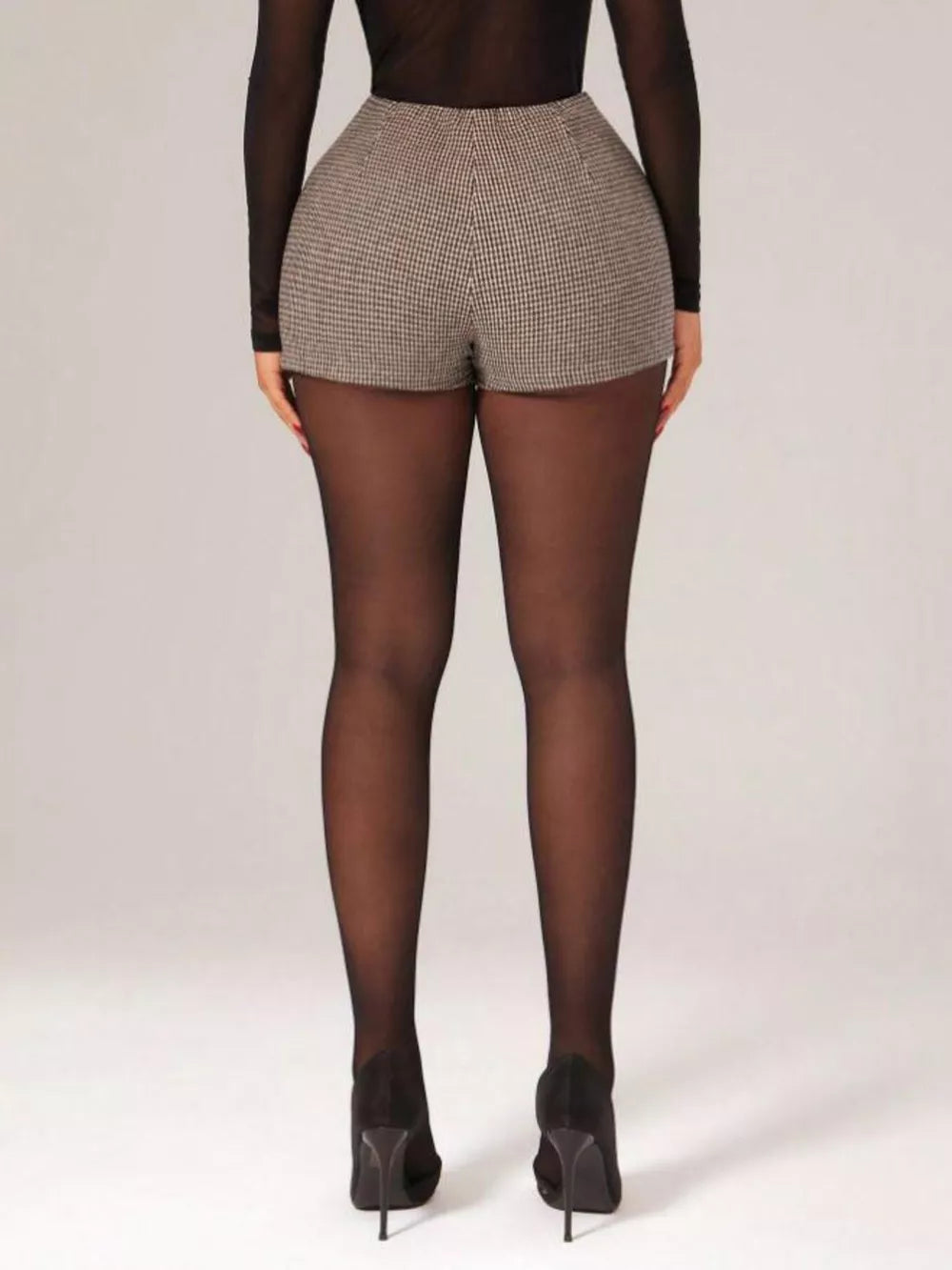 Chic houndstooth high-waisted shorts with a belted detail.