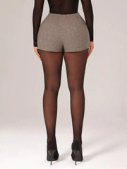 Chic houndstooth high-waisted shorts with a belted detail.