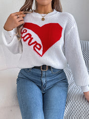 White knit sweater with a red heart graphic and "love" text detail.