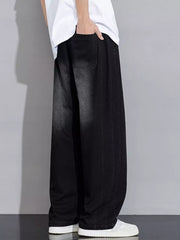 Relaxed fit black denim jeans with wide legs and vintage wash detail.