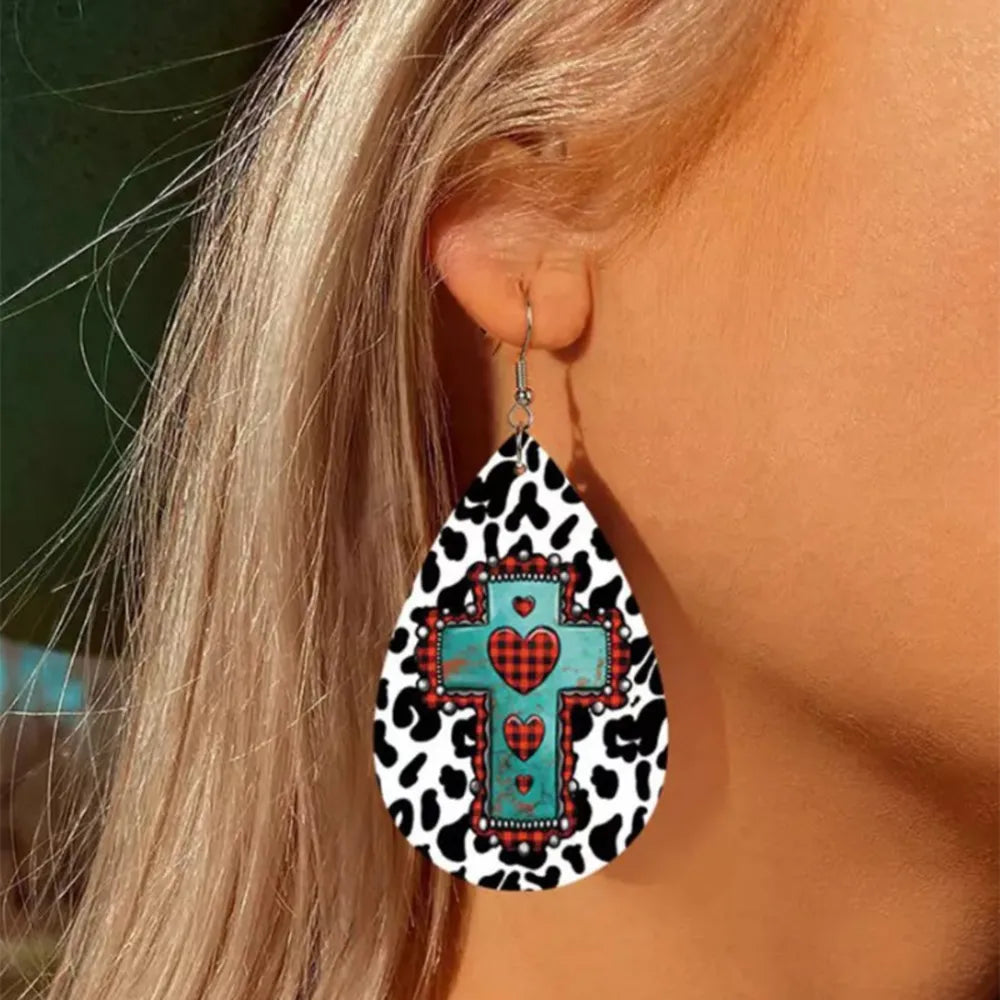 Teardrop earrings with cowhide print and a turquoise cross with red plaid hearts