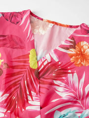 Hot pink tropical print midi dress with V-neck and pleats.