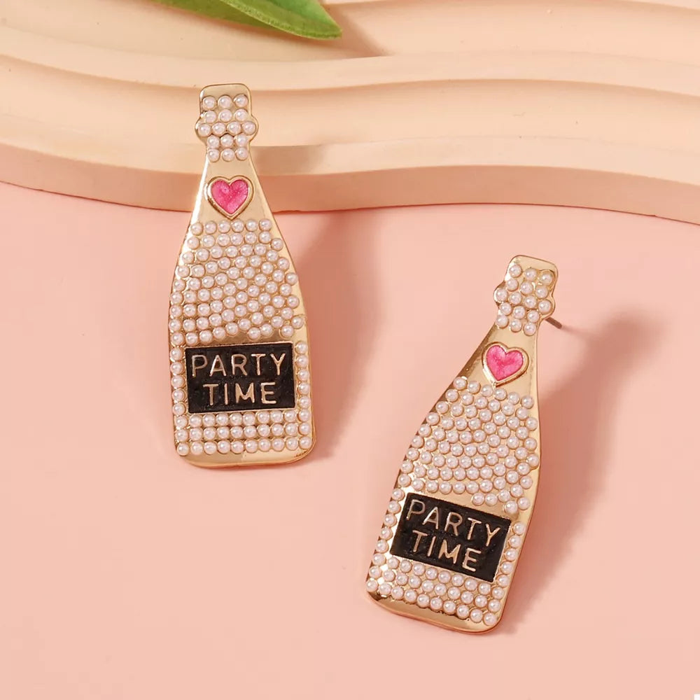 Champagne bottle drop earrings with pearls, pink heart, and PARTY TIME text.