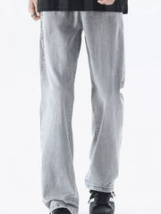 Men's relaxed fit light grey denim jeans with a vintage wash.