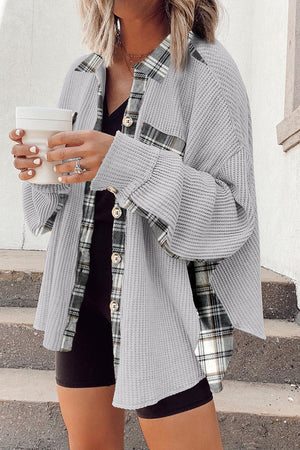 Light gray waffle knit overshirt with plaid trim, button front, and cuffed sleeves.