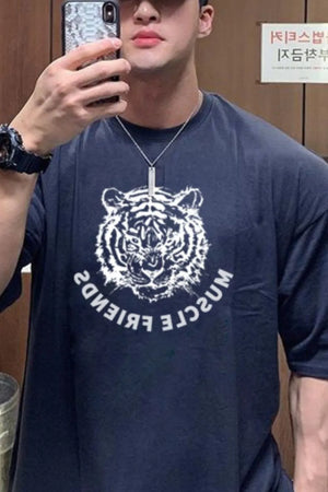 Navy oversized tee with a white tiger graphic and reversed text