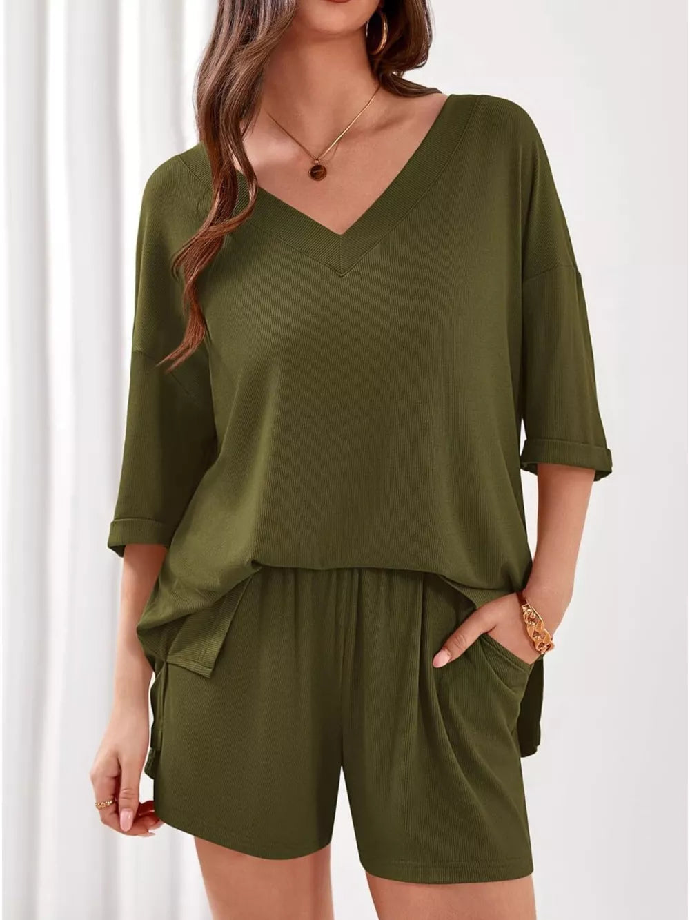 Sage green ribbed V-neck loungewear set with cuffed sleeves and drawstring shorts with pockets.