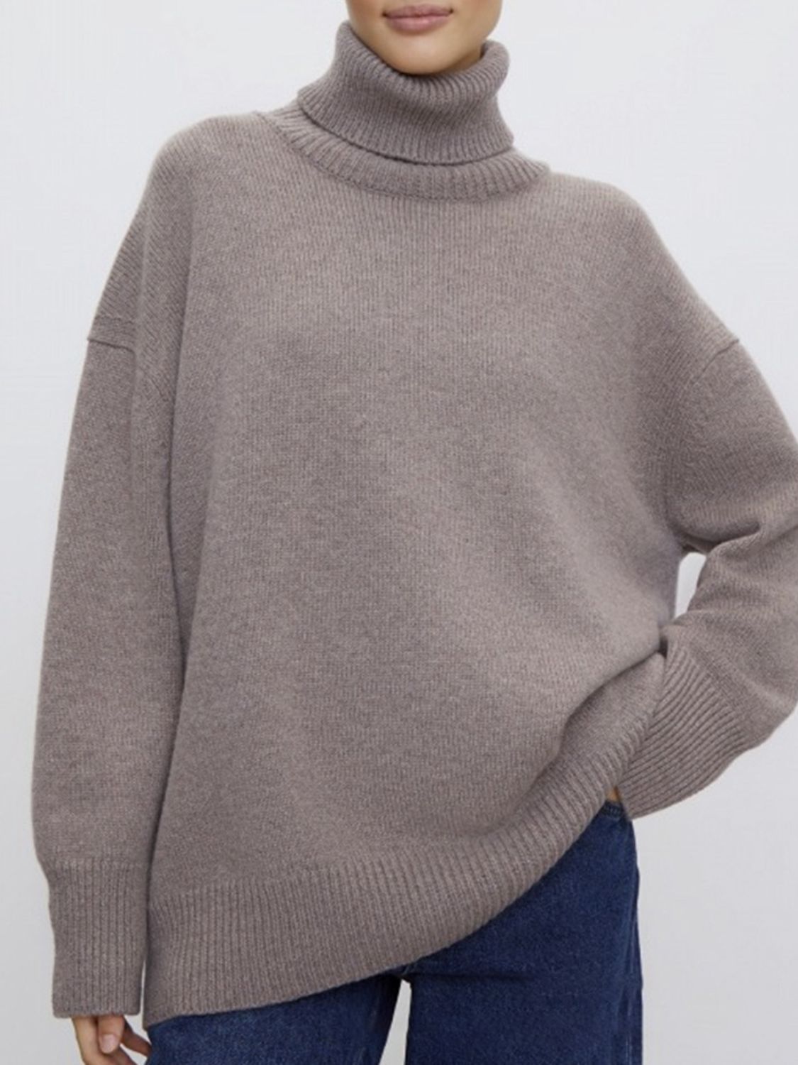 Relaxed turtleneck sweater in acrylic knit, featuring sculptural sleeves and a ribbed hem.