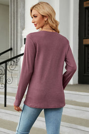 Burgundy waffle knit long sleeve top with crew neck and relaxed fit.