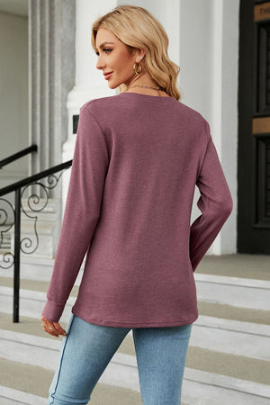Burgundy waffle knit long sleeve top with crew neck and relaxed fit.