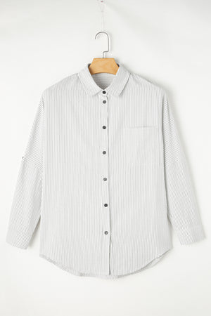 Relaxed white button-down shirt with vertical pinstripes and a chest pocket.