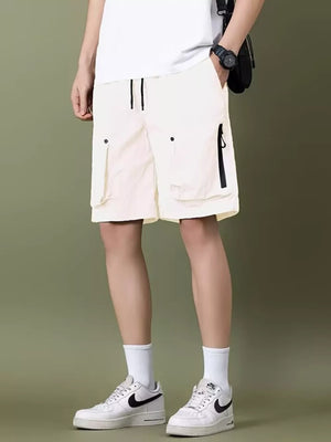 White lightweight cargo shorts with zipper pockets and drawstring waist.