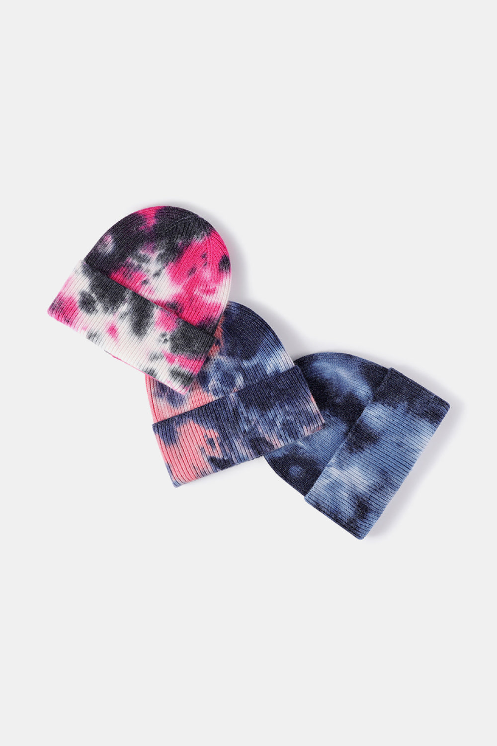 Ribbed knit beanies in Black/Magenta, Navy/Pink, and Sky Blue tie-dye patterns.