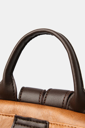 Structured leather convertible backpack in caramel with dark brown handle detail.