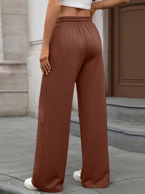 High-waist drawstring wide-leg pants in brown with elastic waistband and relaxed fit.