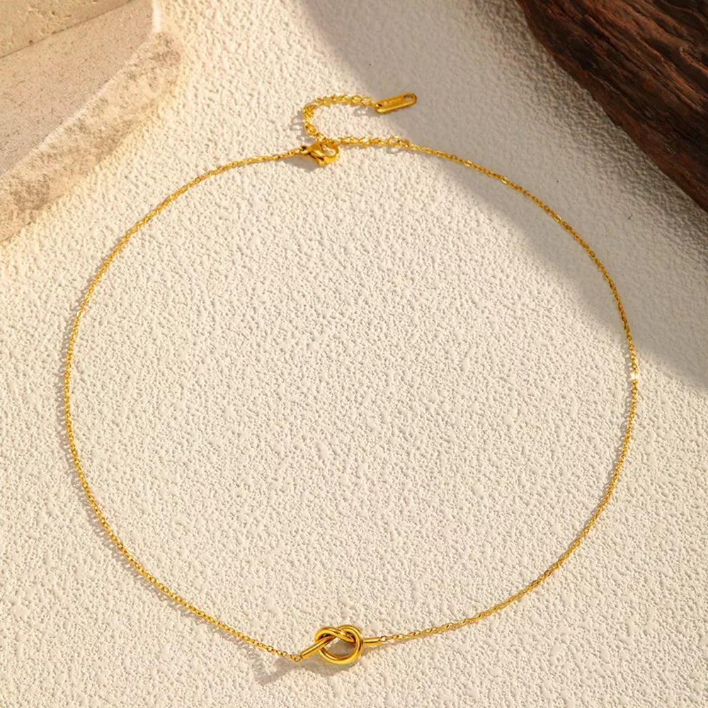 Gold-plated knot pendant necklace with delicate chain